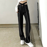 Pantalones rectos con cintura recortada y tecnología negra